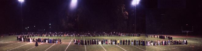 Panorama of celebrants at Coven Oldenwilde's Samhain 97 free public Witch ritual at Asheville's Memorial Stadium