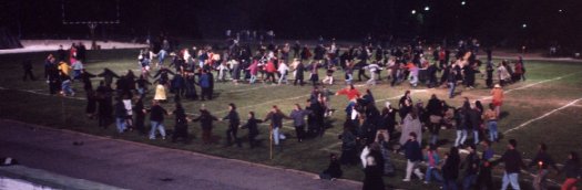 Dancing the spiral dance at Coven Oldenwilde's Samhain 97 free public Witch ritual at Asheville's Memorial Stadium