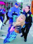 Lady Passion being arrested