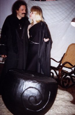 Lady Passion and *Diuvei pose by the cauldron pinata at Coven Oldenwilde's Samhain 97 free public Witch ritual at Asheville's Memorial Stadium