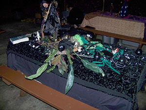 Decorated Earth altar, in tones of green and black.