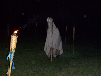 The Mast Beast surrounded by torches and orbs at Asheville's Free Public Witch Ritual